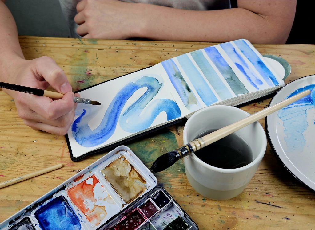 Watercolor artist Kirstin Joy beginning her house-painting project, Cape Town
